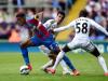 Crystal Palace’s Wilfried Zaha slips through the challenges of Swansea’s Jack Cork and Modou Barrow during the Eagles’ 1-0 win. The Palace winner was scored Marouane Chamakh, his first league goal since September, and the victory saw them finish 10th with a record points tally.