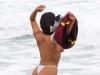 The Latin stunner whips off her kit while cavorting on a Portuguese beach