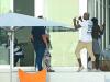 Paul Pogba, wearing a T-shirt with his own name and number on the back, looks to be explaining his actions to agent Raiola away from the party in Miami