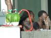 Romelu Lukaku and a friend chill by the pool next to water melon shisha pipes